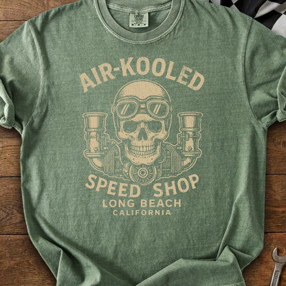 Green t-shirt with "AIR-KOOLD SPEED SHOP LONG BEACH CALIFORNIA" text and skull graphic.