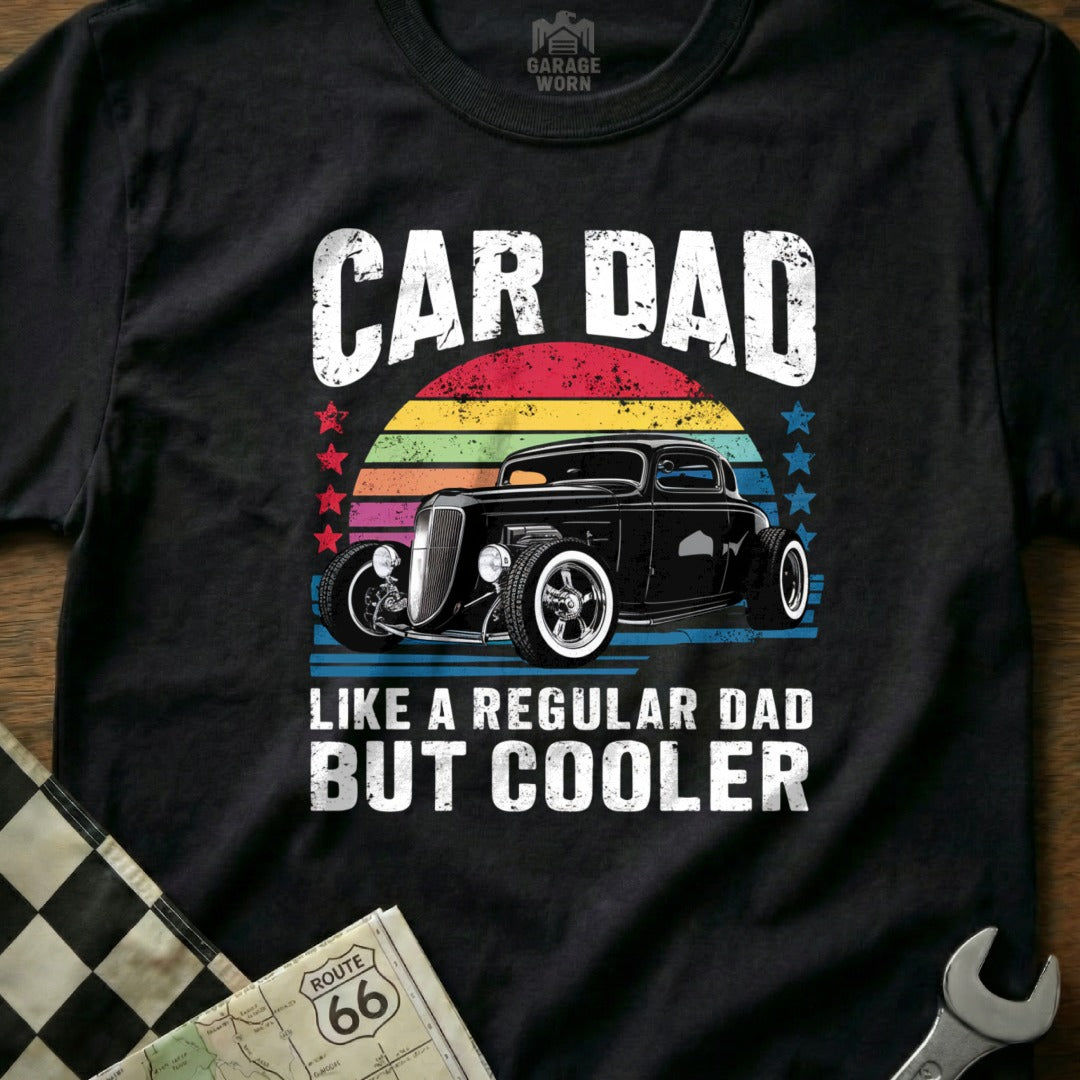 Black hot rod with "Car Dad" text and sunset background on t-shirt.