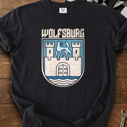 Black t-shirt featuring a distressed Wolfsburg crest with a stylized wolf atop a castle.