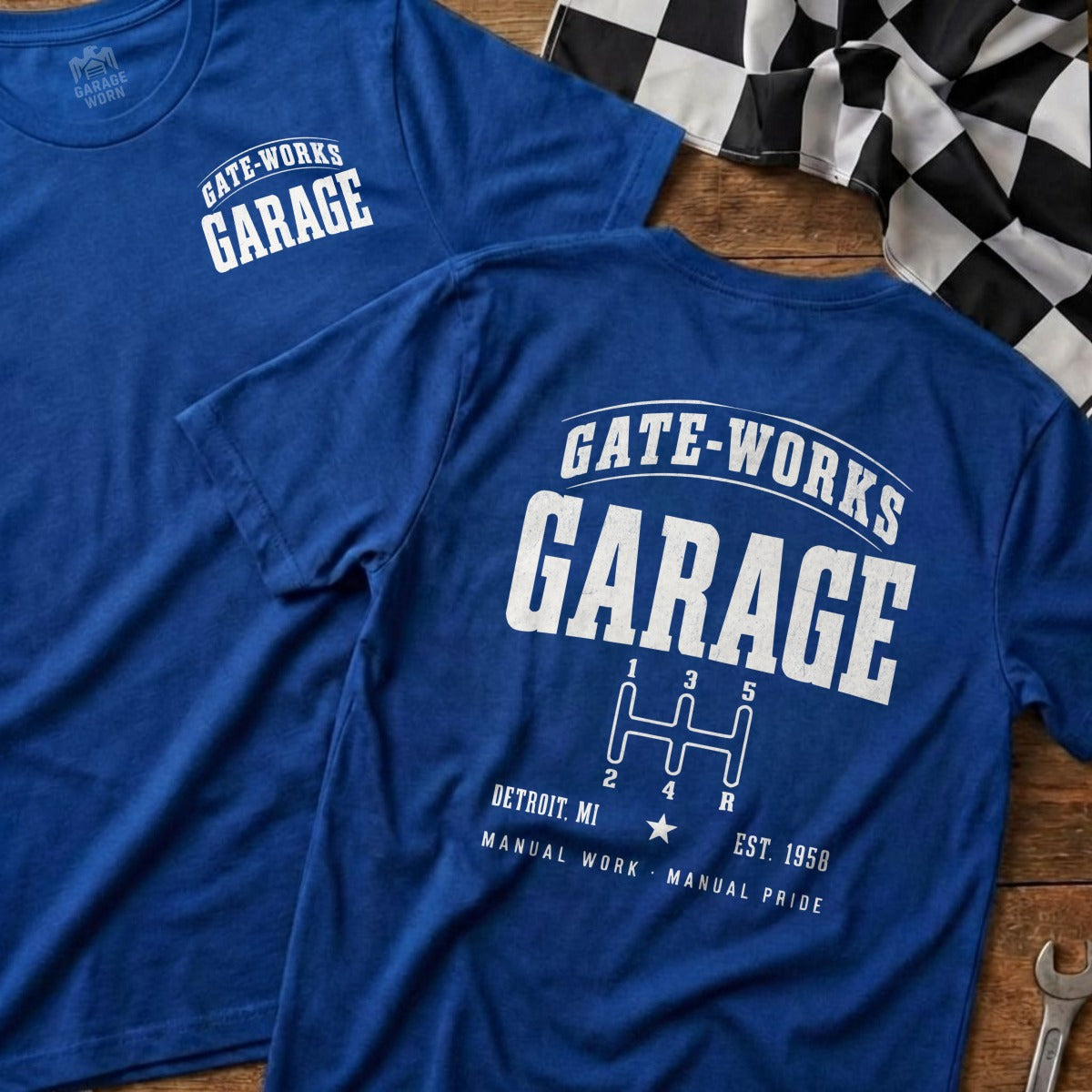 Blue GATE-WORKS GARAGE t-shirt with gear shift graphic.