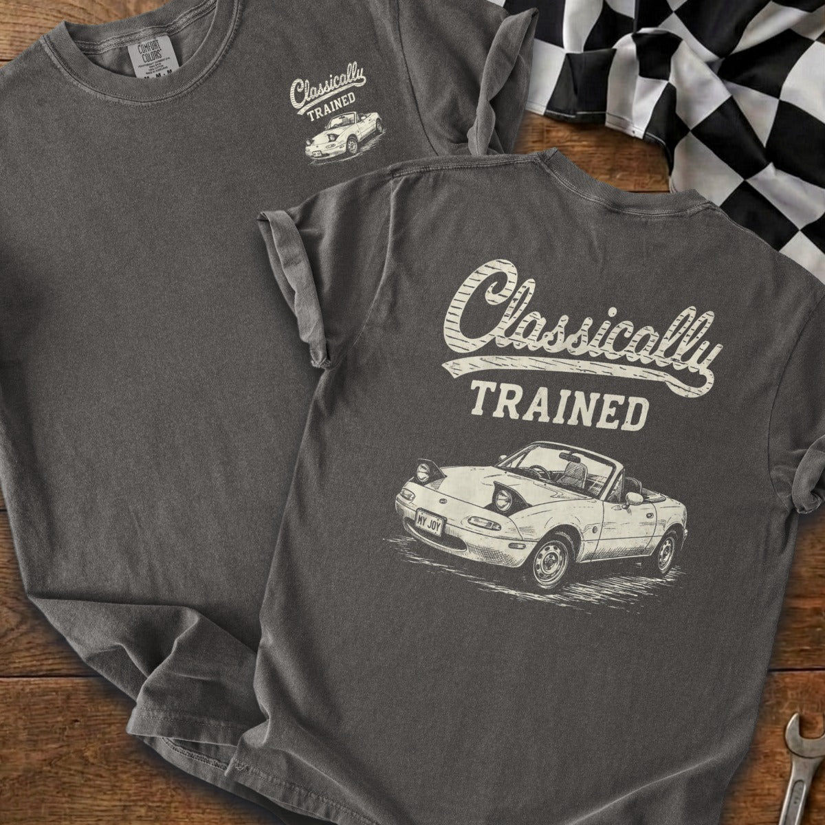 Dark grey t-shirt with "Classically TRAINED" and a drawn classic sports car.