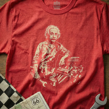 Albert Einstein wearing mechanic's overalls with engine parts and tools.