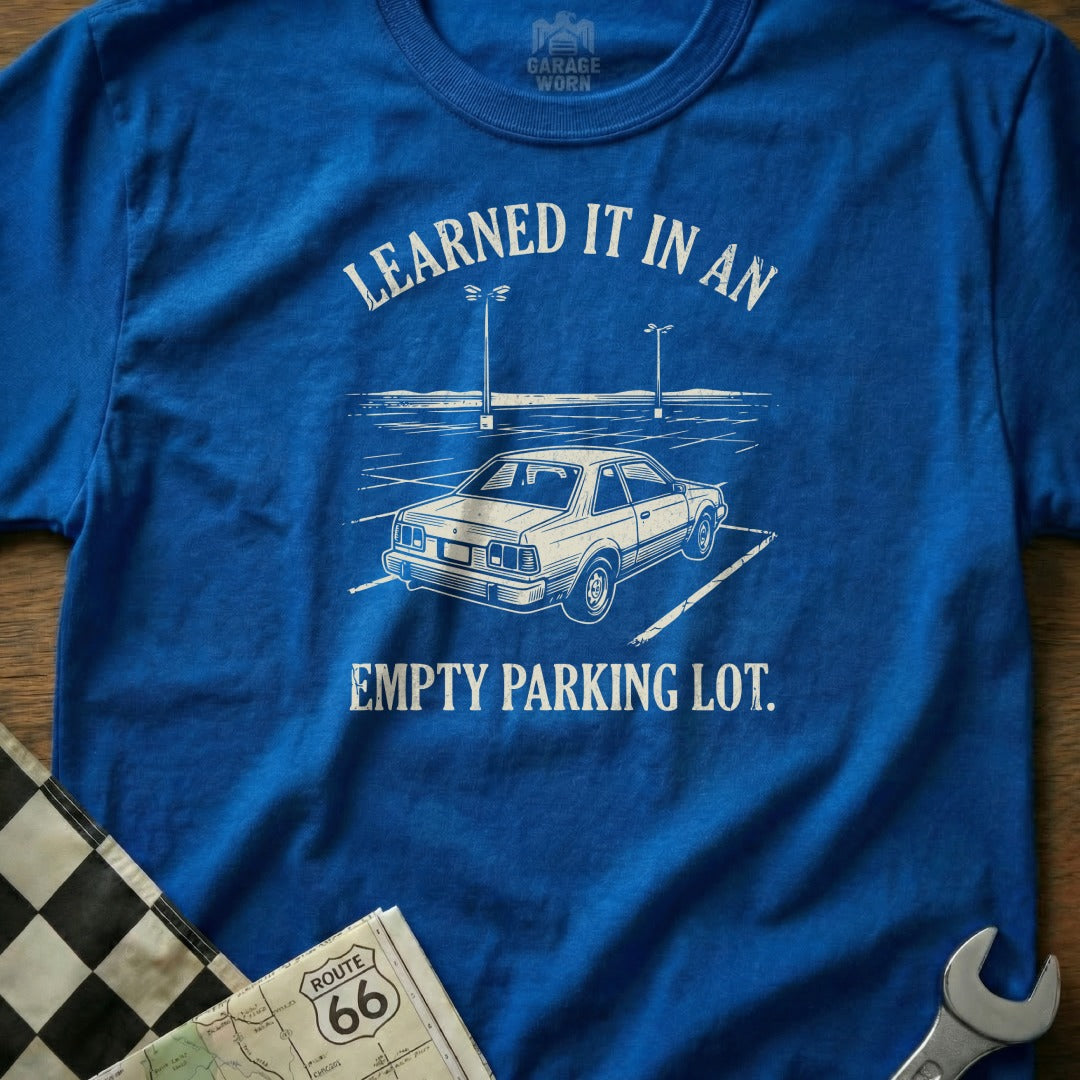 Blue t-shirt with "Learned It In An Empty Parking Lot" and car graphic.