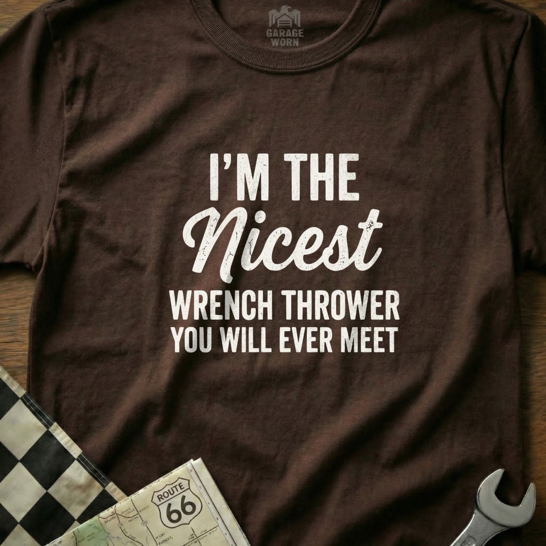 Brown t-shirt with white text "I'm the nicest wrench thrower you will ever meet."