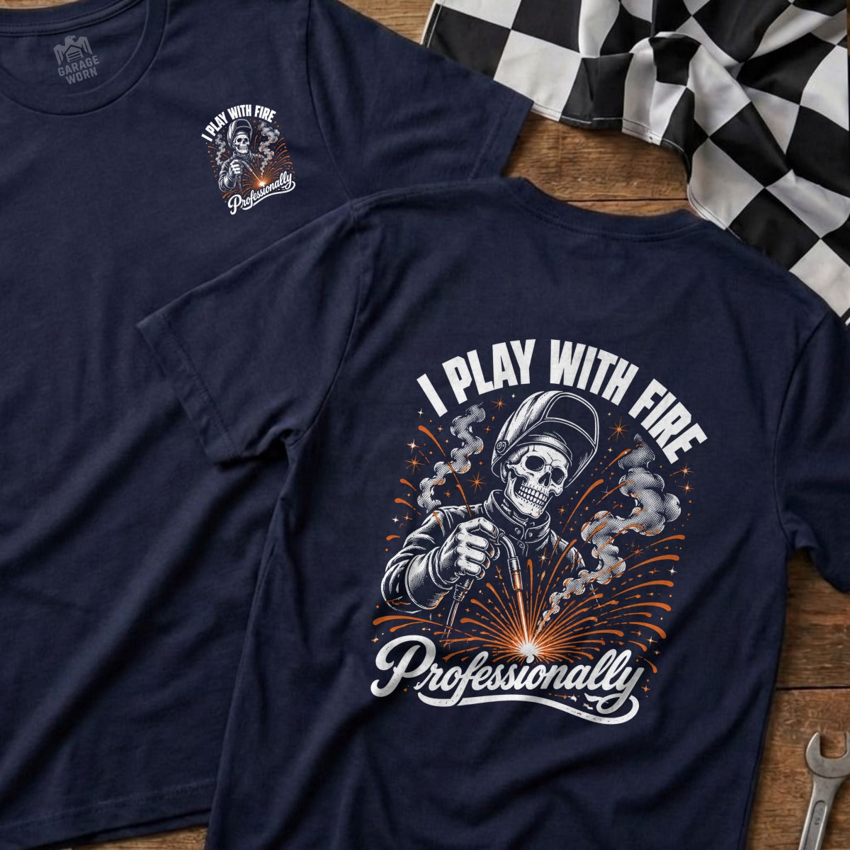 Navy t-shirt with skeleton welder graphic and text "I PLAY WITH FIRE Professionally."