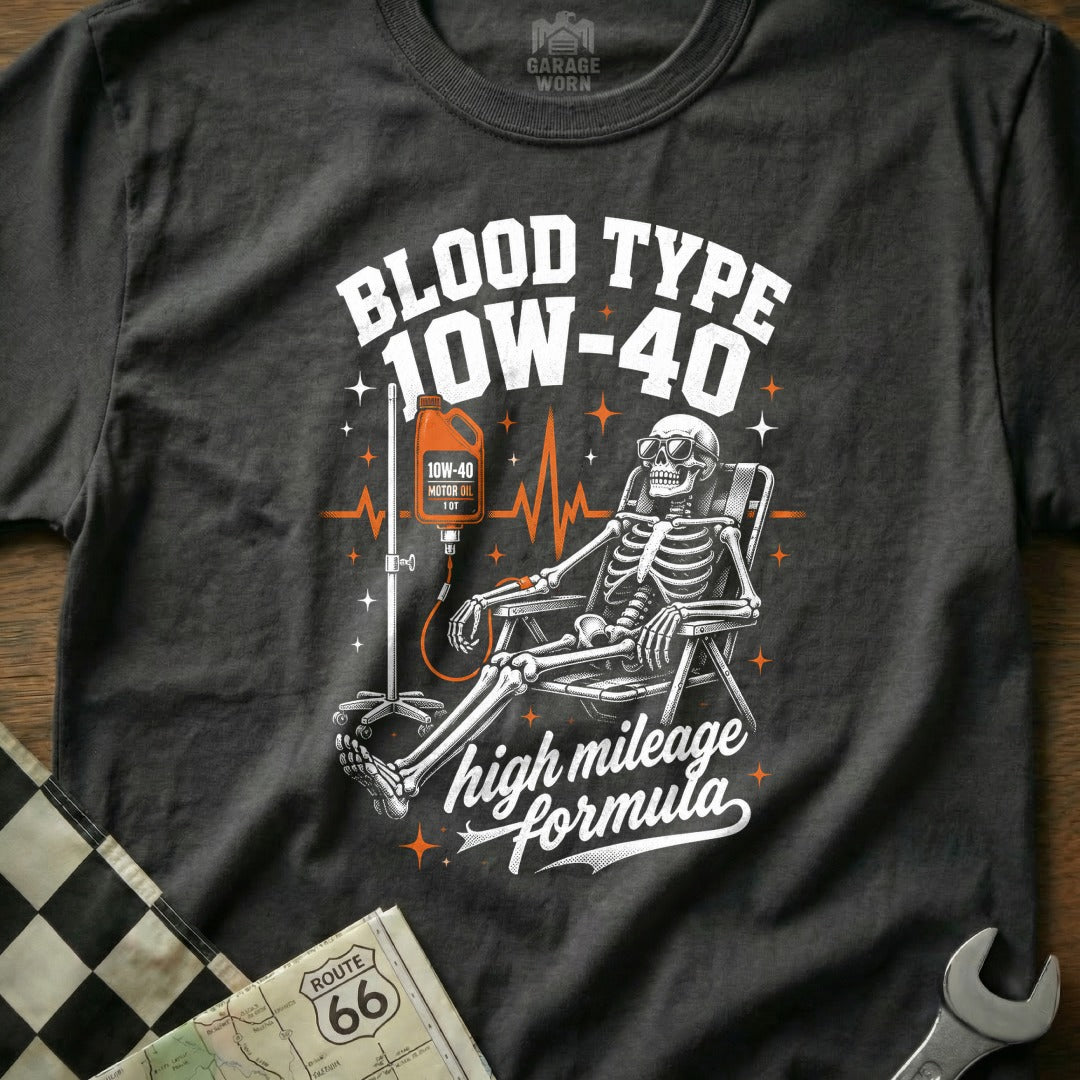 T-shirt graphic of a skeleton receiving an IV of 10W-40 motor oil.