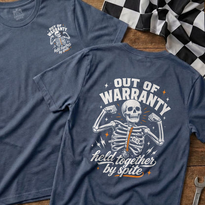 T-shirt with skeleton graphic, text "OUT OF WARRANTY held together by spite".