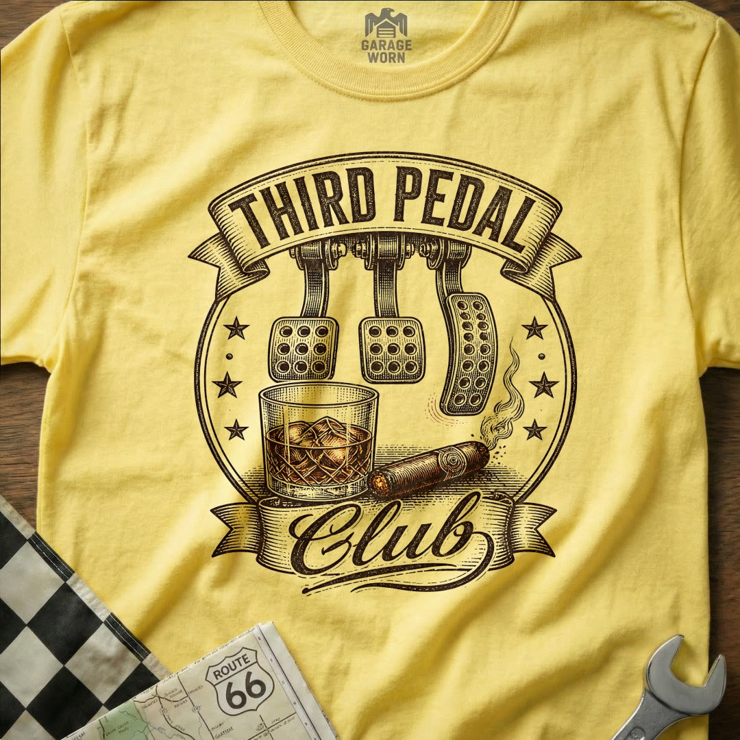 Yellow t-shirt with "Third Pedal Club" text, clutch pedals, whiskey, and cigar graphic.