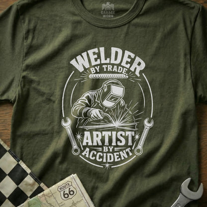 Welder by Trade, Artist by Accident graphic with welder, wrenches and "Garage Worn" logo.