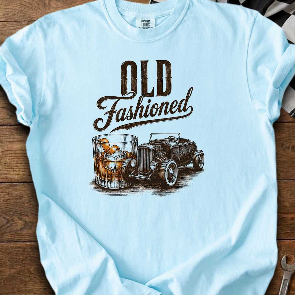 Light blue t-shirt with "OLD Fashioned" text, a whiskey glass, and a hot rod car.