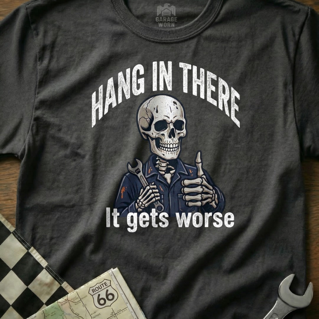 Skeleton mechanic giving thumbs up with wrench, "Hang in there it gets worse" text.