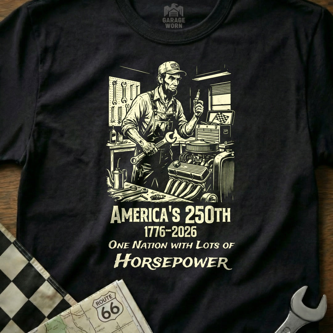 Black t-shirt with mechanic graphic, "America's 250th 1776-2026 One Nation With Lots Of Horsepower."