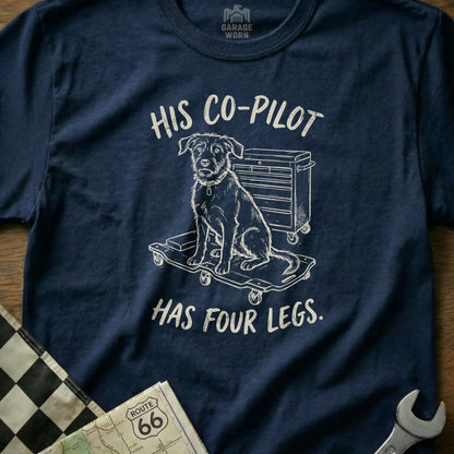 Navy t-shirt with illustration of dog on toolbox, text reads "HIS CO-PILOT HAS FOUR LEGS."