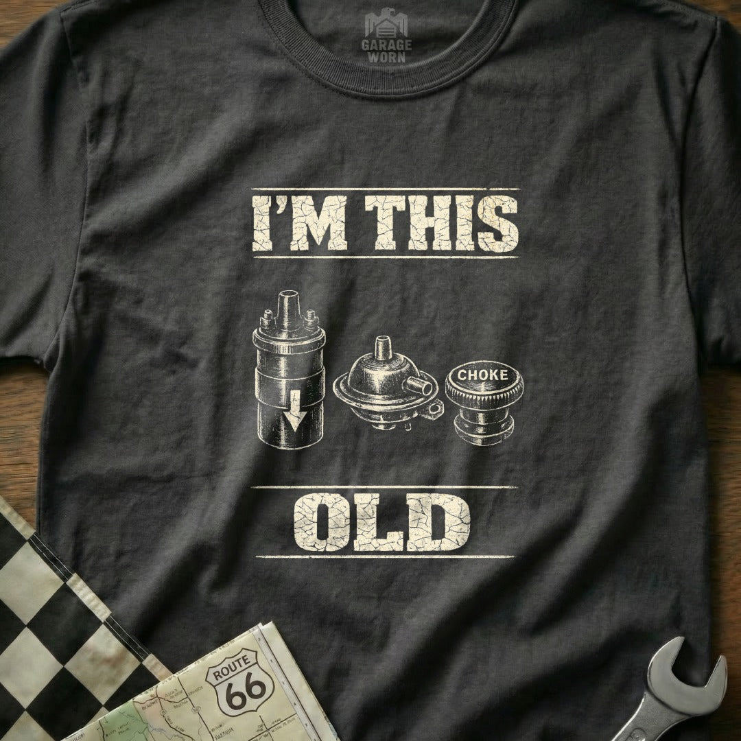 Black t-shirt with "I'M THIS OLD" text and vintage car parts illustration.