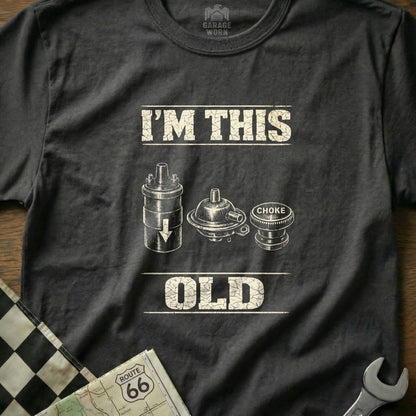 Black t-shirt with "I'M THIS OLD" text and vintage car parts illustration.