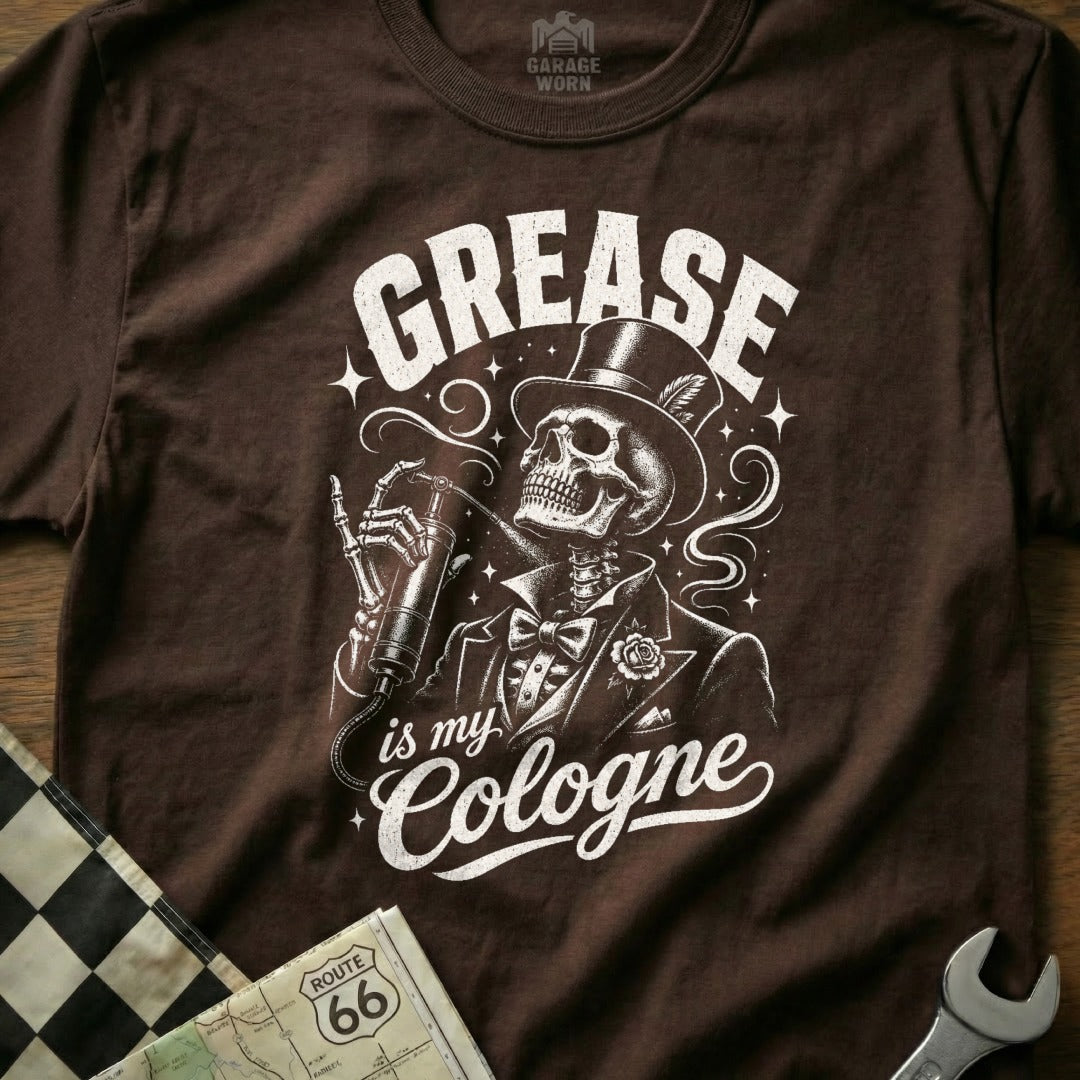 Brown t-shirt with skeleton in suit applying grease quote: "Grease is my Cologne".