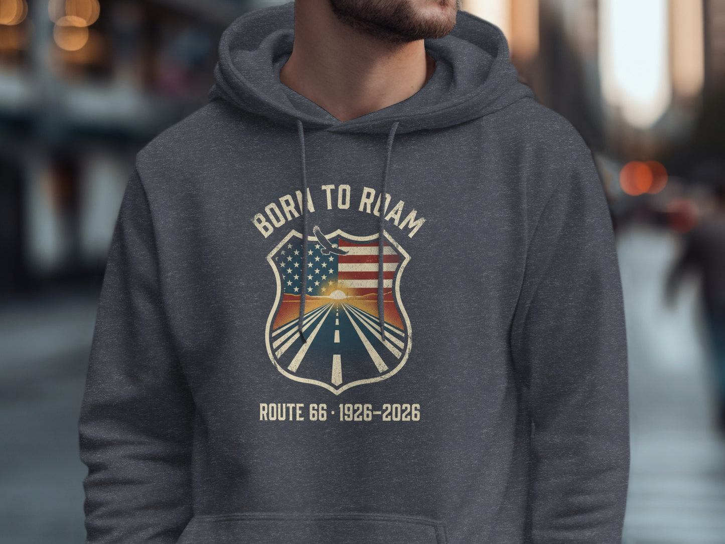 Gray hoodie with "Born to Roam" shield design featuring Route 66 sunset.
