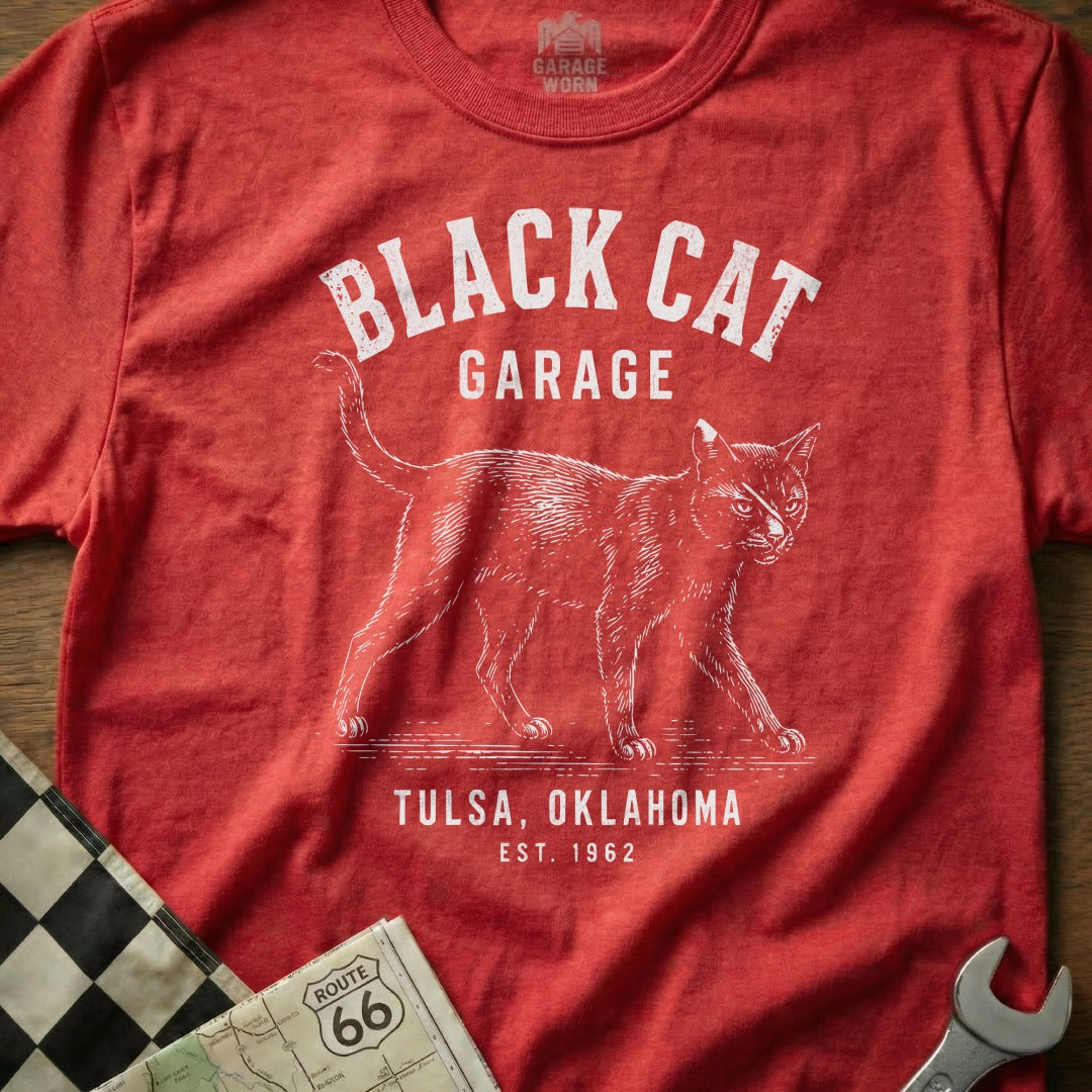 Red t-shirt with white text "Black Cat Garage Tulsa, Oklahoma Est. 1962" and a sketched cat.