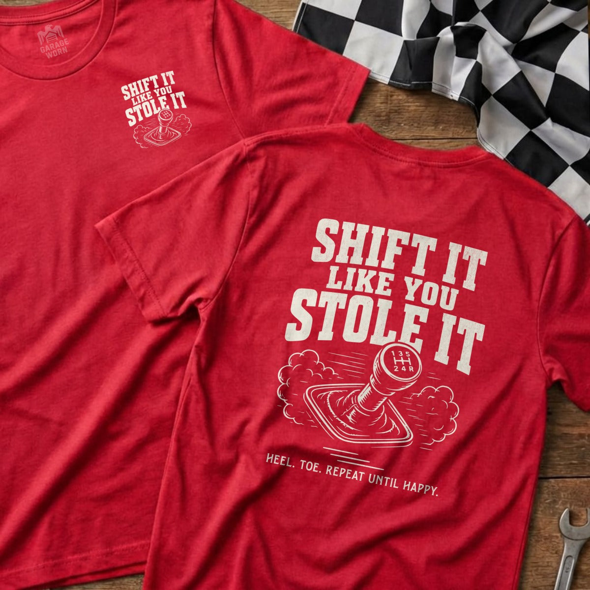 Red t-shirt with "Shift It Like You Stole It" graphic and gear shifter.