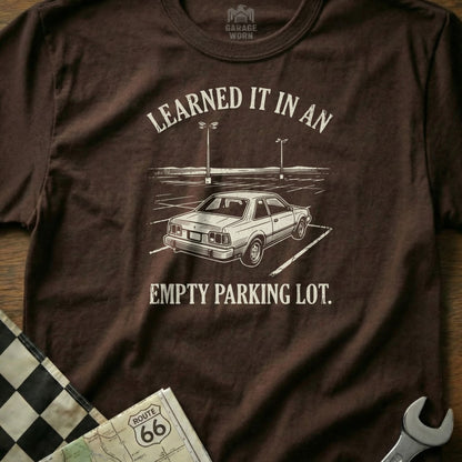 Brown t-shirt with "Learned it in an empty parking lot" and a car graphic.