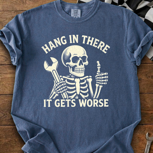 Skeleton with wrench and thumbs up on blue t-shirt with text "Hang in There, It Gets Worse."