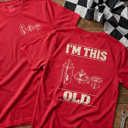 Red t-shirt with "I'M THIS OLD" and vintage engine parts graphic.