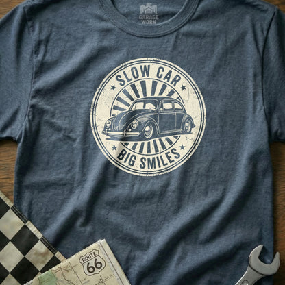 T-shirt featuring a vintage Volkswagen Beetle and "Slow Car Big Smiles" text.