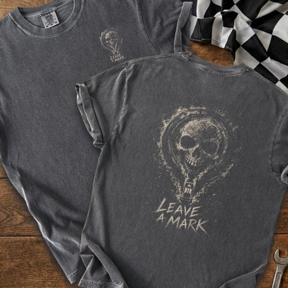 Dark grey t-shirt with skull graphic and "LEAVE A MARK" text on the back.