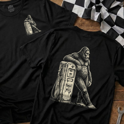 Black t-shirt with Bigfoot leaning on a vintage gas pump graphic.