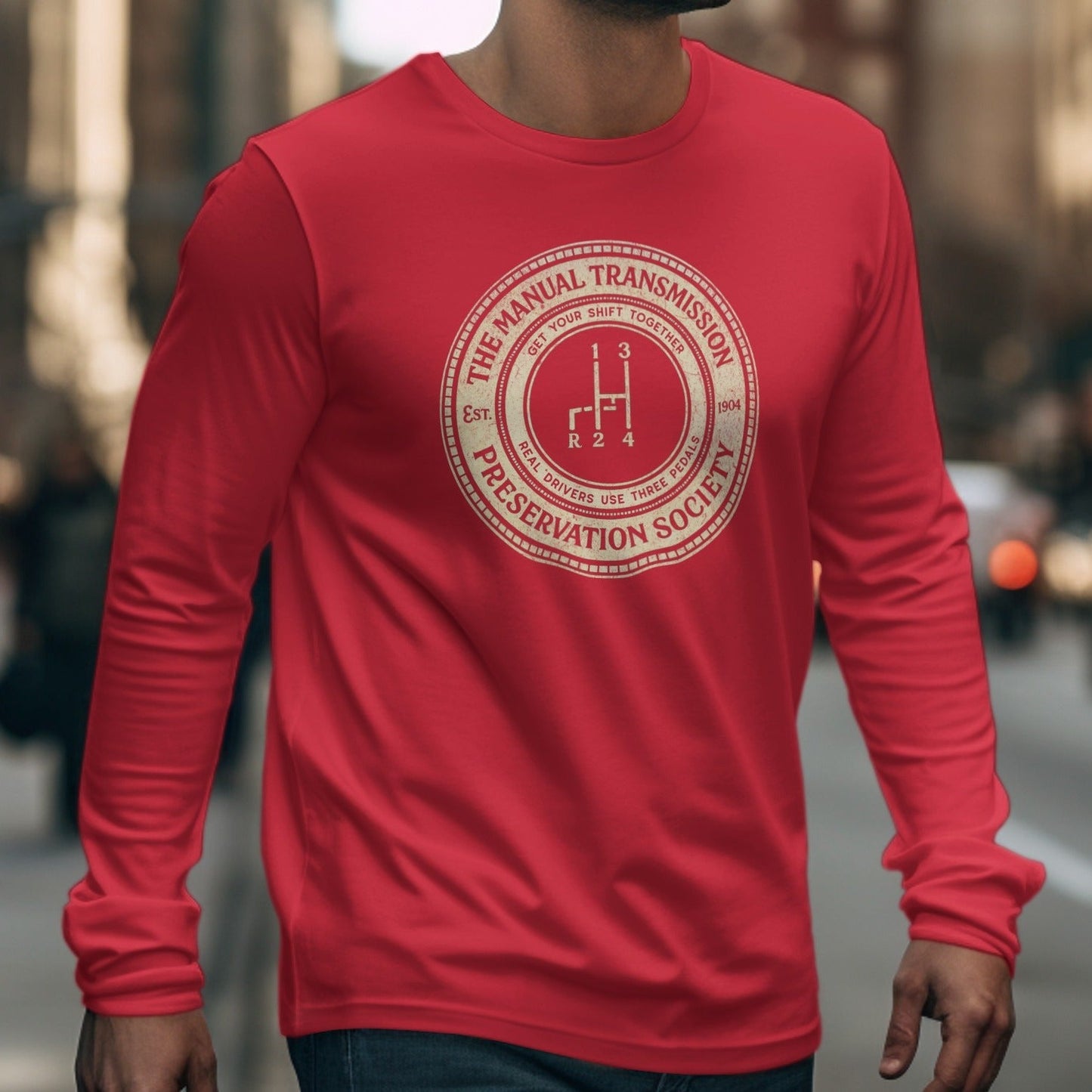 Red long-sleeve shirt with "Manual Transmission Preservation Society" emblem.