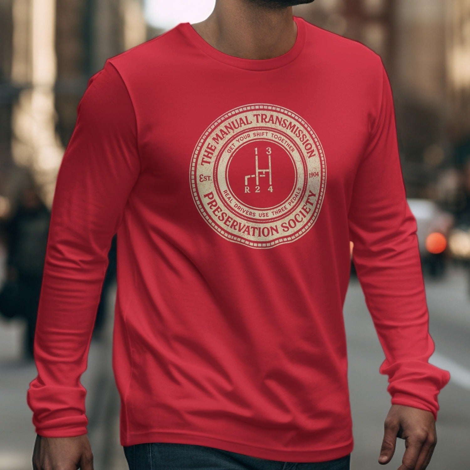 Red long-sleeve shirt with "Manual Transmission Preservation Society" emblem.