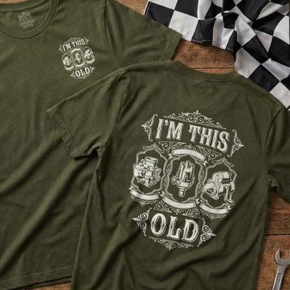 Olive green t-shirt with "I'm This Old" and vintage engine parts graphic.