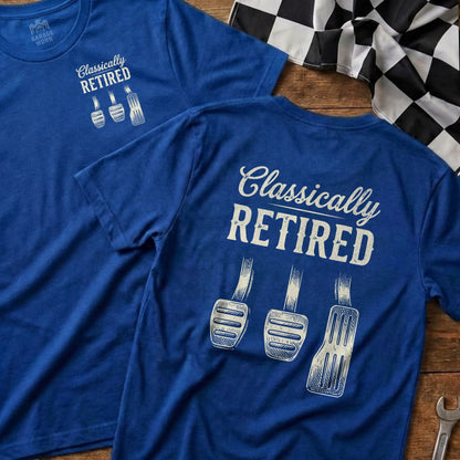 Blue t-shirt with "Classically Retired" and three pedals printed on back.