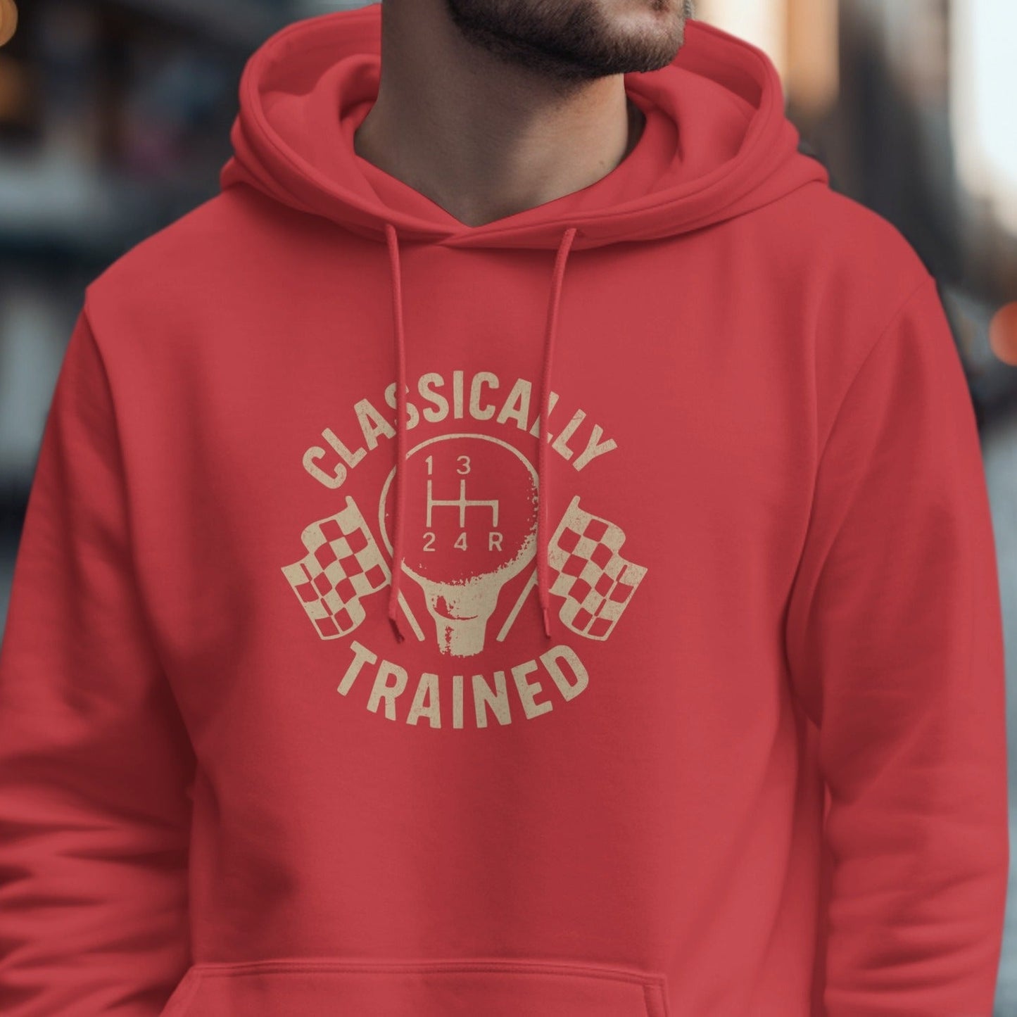 Red hoodie with tan graphic of a shift knob, checkered flags, and text.