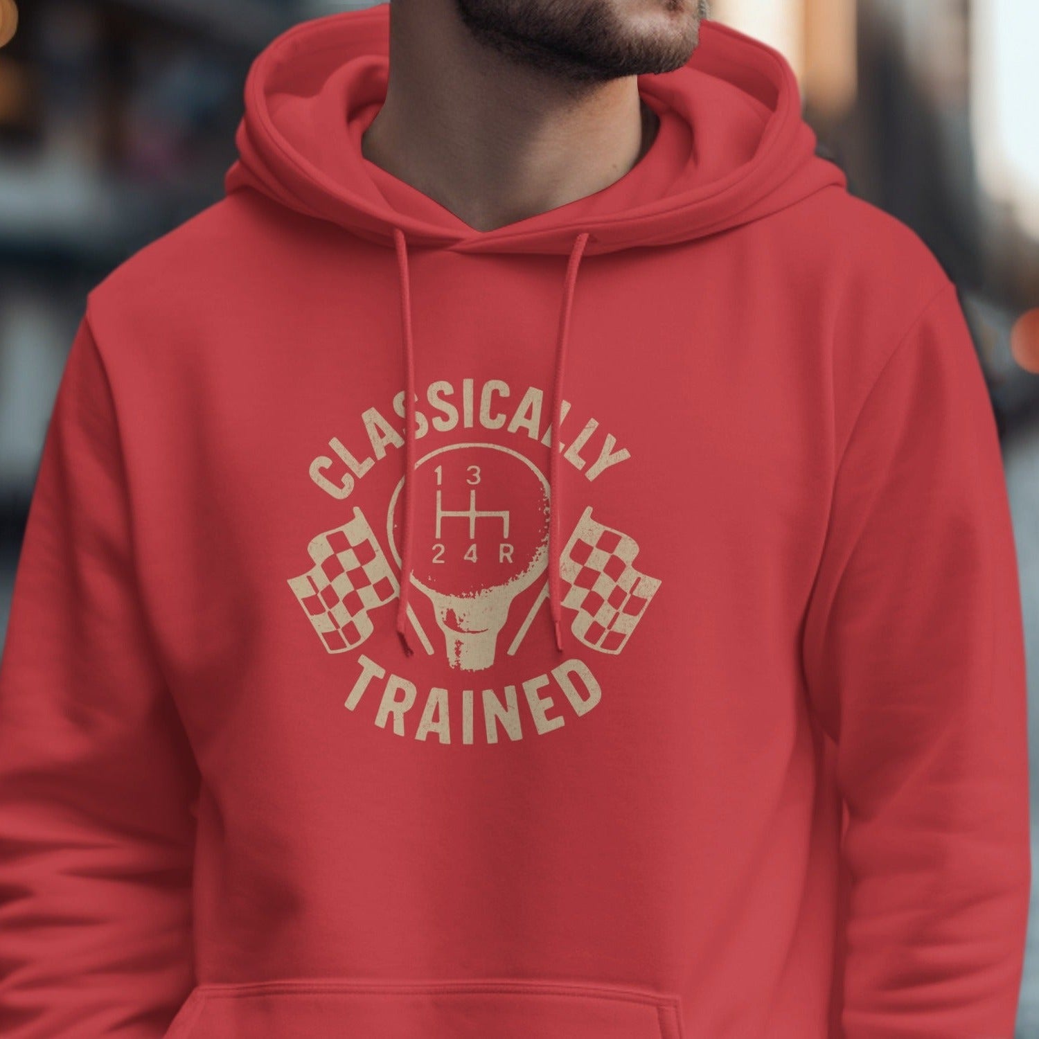 Red hoodie with tan graphic of a shift knob, checkered flags, and text.