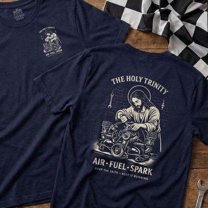 Navy t-shirt with Jesus working on an engine, "The Holy Trinity Air-Fuel-Spark" text.