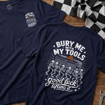 Navy t-shirt with graphic of skeletons carrying a toolbox and text "Bury Me With My Tools Good Luck Lifting It".