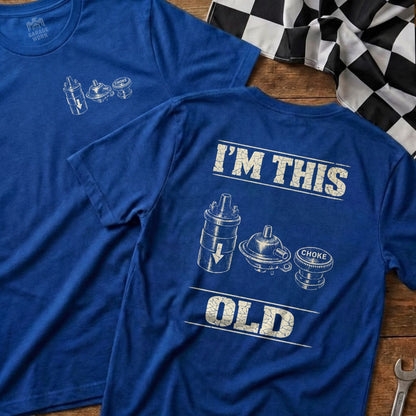 Two blue t-shirts with vintage carburetor and choke graphic and text.