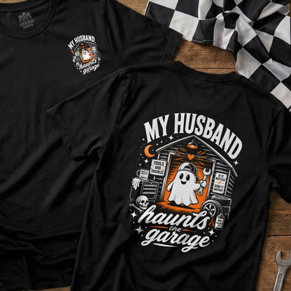 Black t-shirt with "My Husband Haunts the Garage" graphic featuring a ghost and garage tools.
