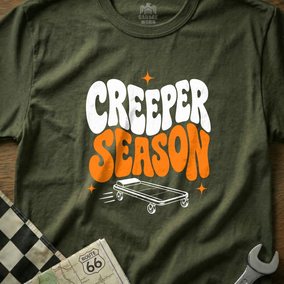 Green t-shirt with "CREEPER SEASON" text and a mechanic's creeper graphic.