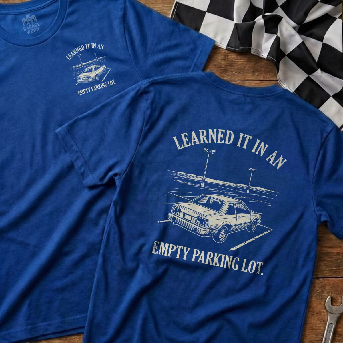 Blue t-shirts with text "Learned it in an empty parking lot."
