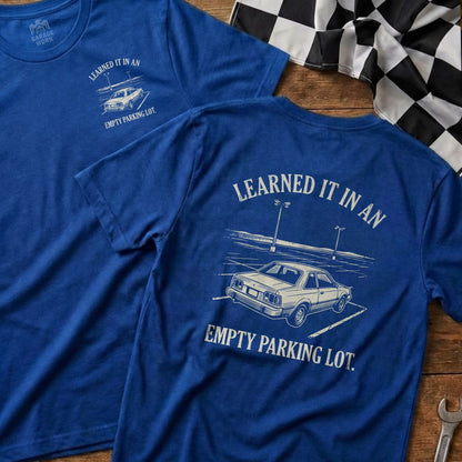 Blue t-shirts with text "Learned it in an empty parking lot."