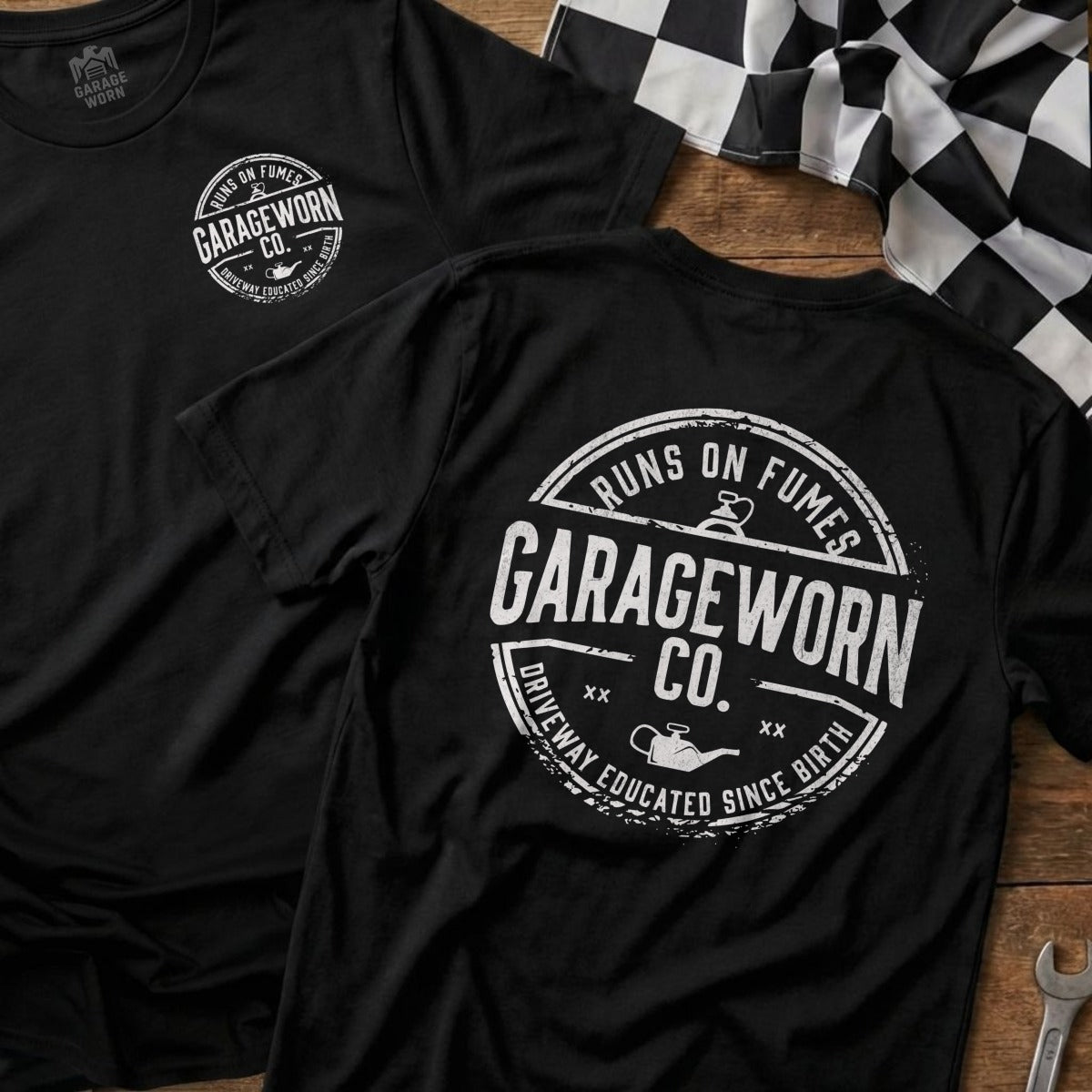 Black t-shirt with "Garage Worn Co. Runs on Fumes" text, checkered flag.
