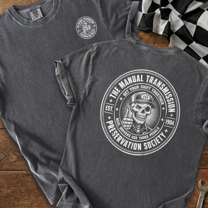 Gray t-shirt with skull logo: "The Manual Transmission Preservation Society."