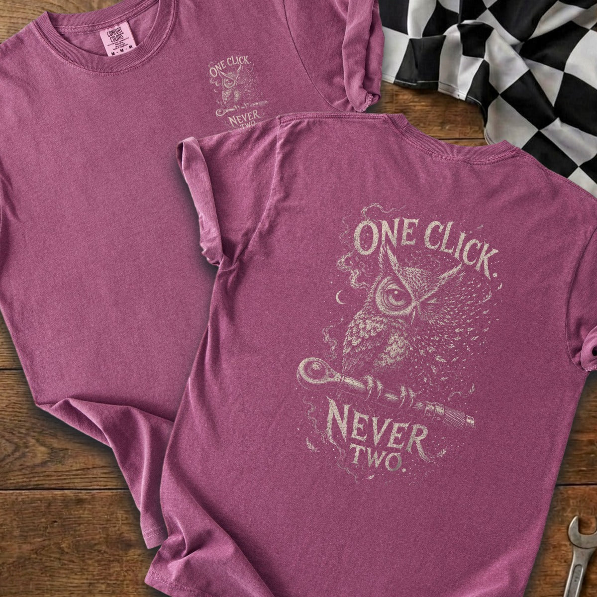 Purple t-shirt with "One Click Never Two" text and an owl with a wrench graphic.