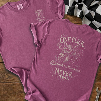 Purple t-shirt with "One Click Never Two" text and an owl with a wrench graphic.