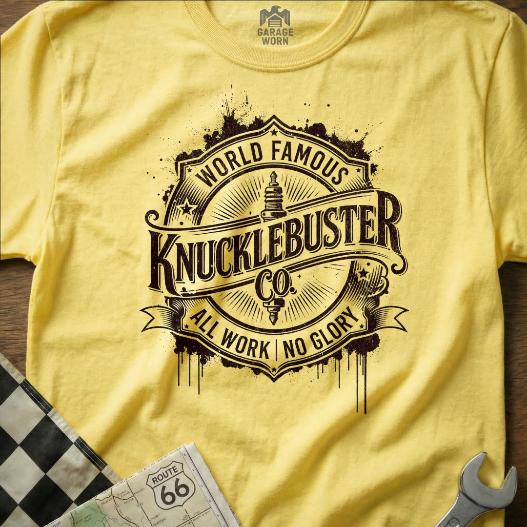 Yellow t-shirt with "World Famous Knucklebuster Co. All Work No Glory" logo and Route 66 map.