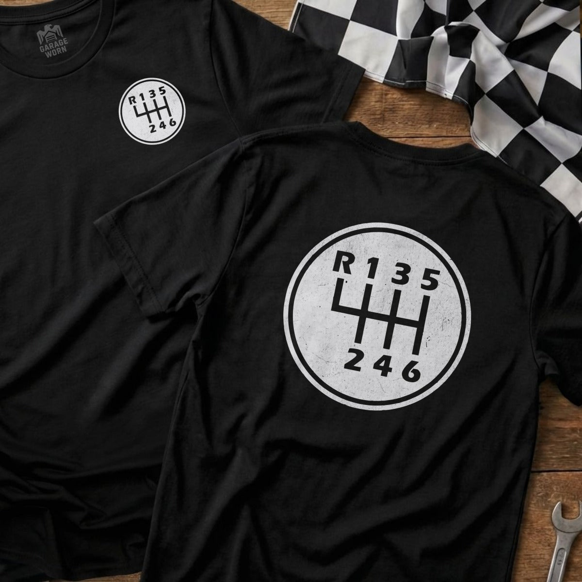 Black t-shirt with white R135246 manual transmission shift pattern graphic.