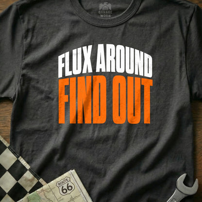Dark grey t-shirt with white text "FLUX AROUND" above orange text "FIND OUT".