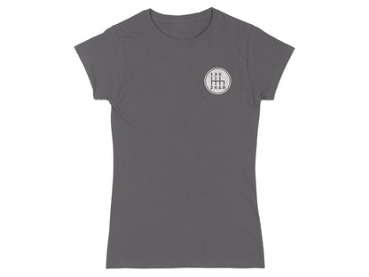 Dark gray t-shirt with a white manual transmission shift pattern graphic.